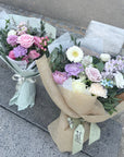Bouquets of flowers on a concrete surface