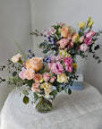 Bigger Daily Flowers in a Mason Jar shown on a side table for a home display
