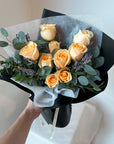 rose bouquet with dried lavender and eucalyptus leaves and black wrapping