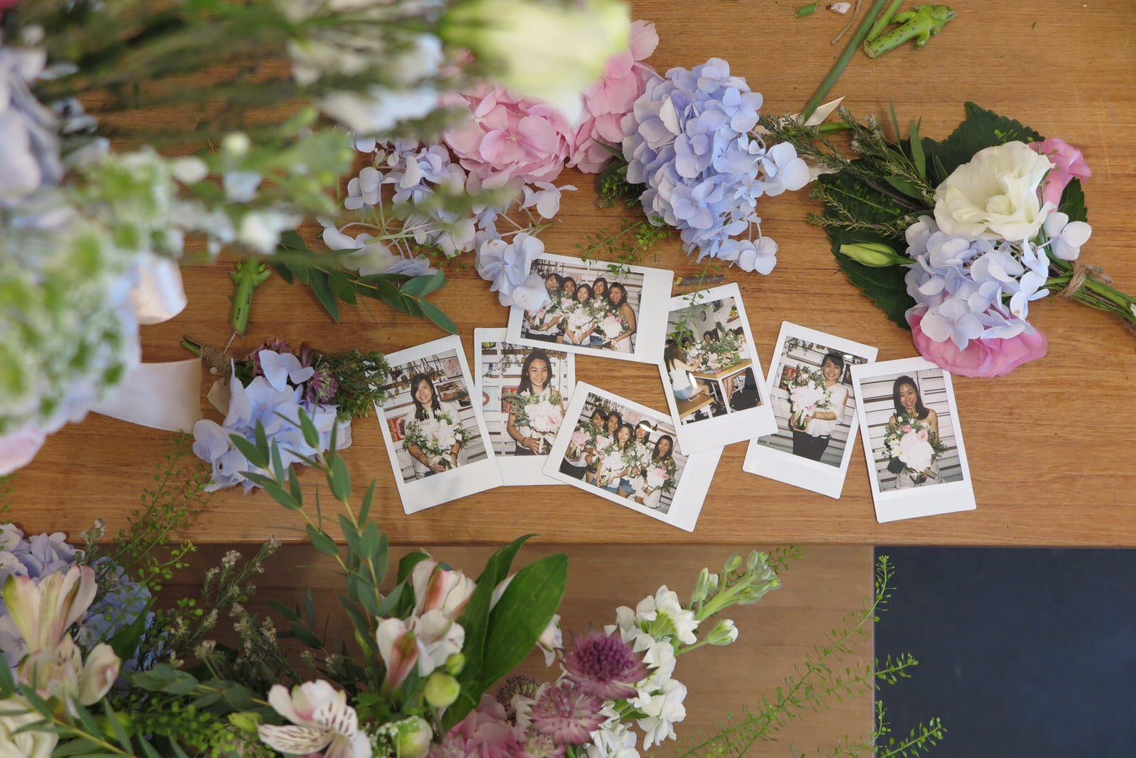 pictures on the table with flowers everywhere