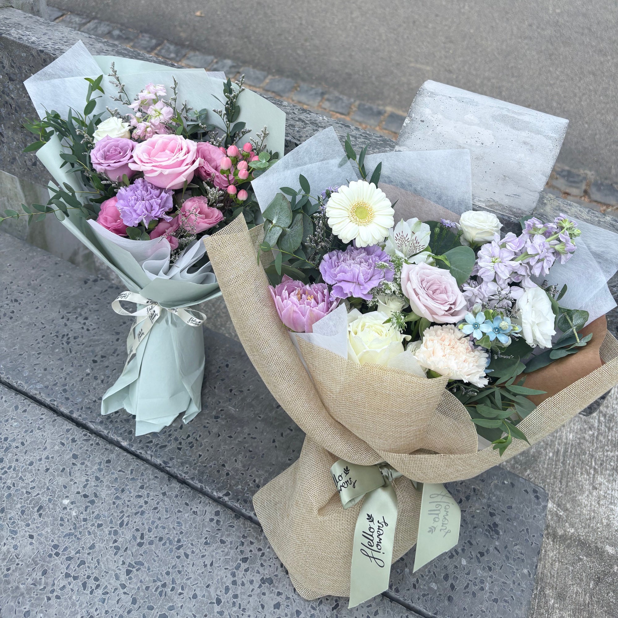 Bouquets of flowers on a concrete surface