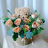 Bella cappuccino rose bouquet held in a teddy bear holder