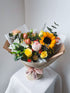 Sunshine bouquet with bright yellow, orange and champagne blooms