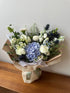 Serene bouquet with blue hydrangea and white blooms hand-tied