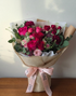 Roselle pink and burgundy rose bouquet hand-tied