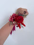 Preserved wrist corsages styled together to show colour and design options