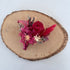 Multiple preserved boutonnière designs styled together to show options
