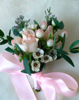 pink and white wrist corsage