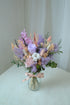 Poppy Jar preserved arrangement in soft purple and lilac in a glass jar