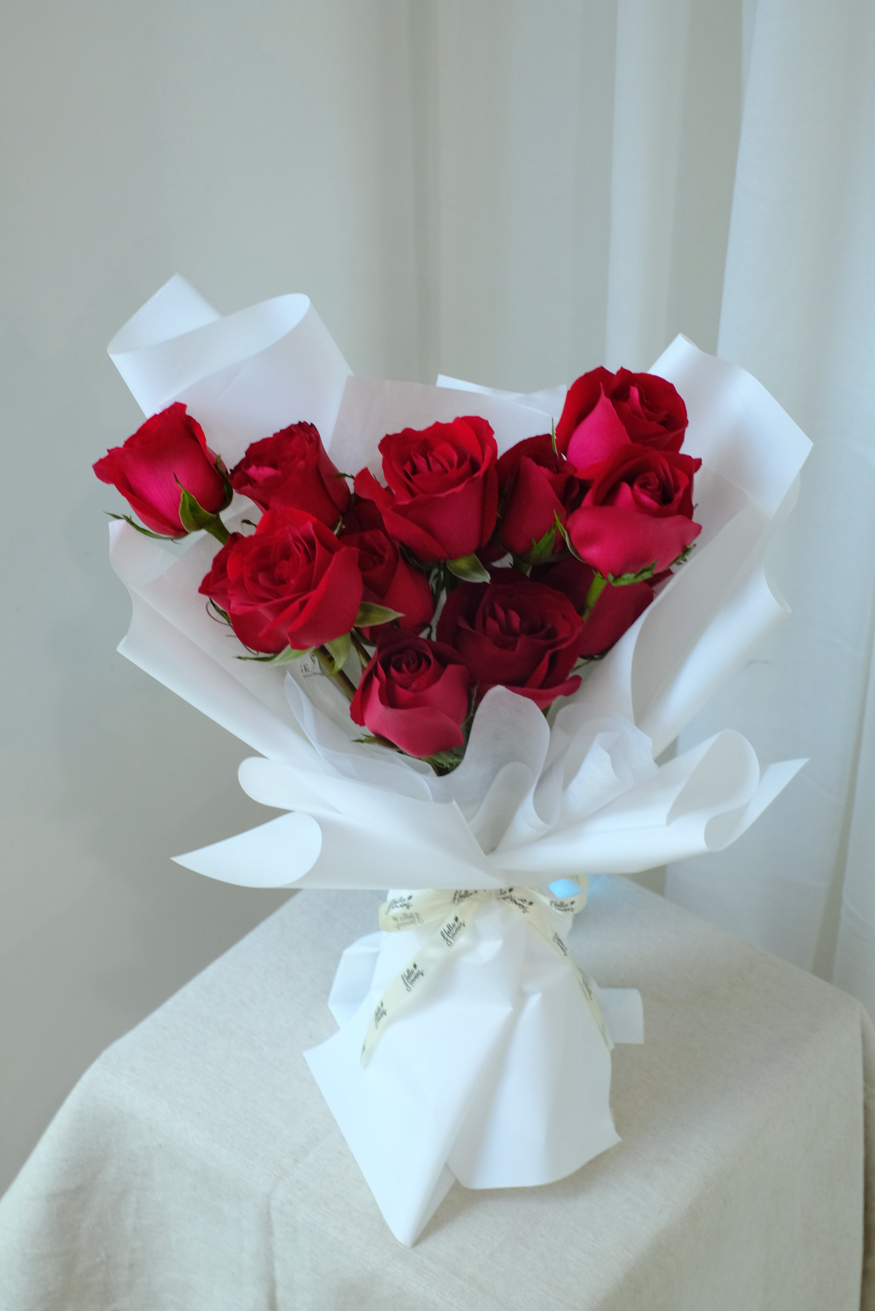 Ruby - Red Roses in White Wrapping - 14 Stalks