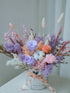 Primrose preserved flower arrangement in a silver gift box