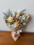 Apricot Daydream bouquet with champagne and cappuccino roses in a warm cream palette
