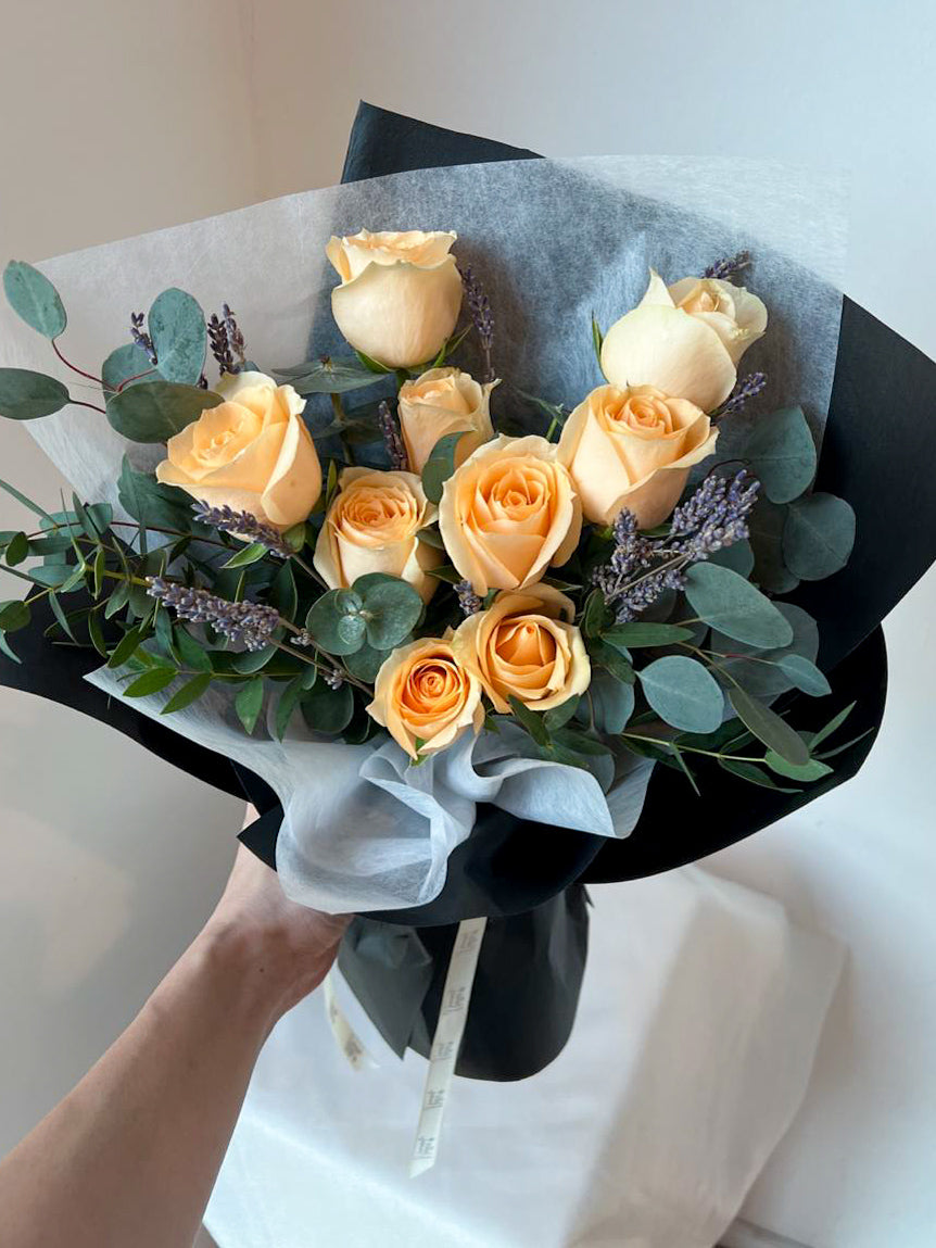 rose bouquet with dried lavender and eucalyptus leaves and black wrapping