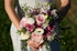Pastel round fresh flower bridal bouquet in pinks and lilacs