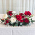 Long low table centrepiece styled close-up to show the bloom mix